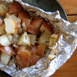 Potatoes in tinfoil on the BBQ